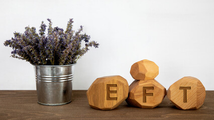 Letters EFT written on wooden blocks. Emotion-focused therapy treatment concept.