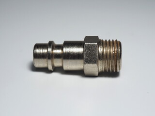 Air nipple on most pneumatic tools of small and medium sizes. Plugin nipple on white background....