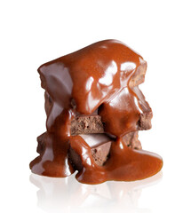 Pieces of chocolate in melting chocolate isolated on white background.