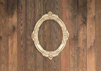 artistic gold frame on wooden wall