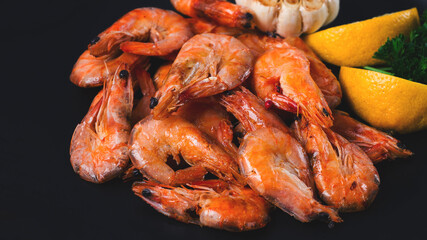 Fried shrimp, on a black background, top view, no people,