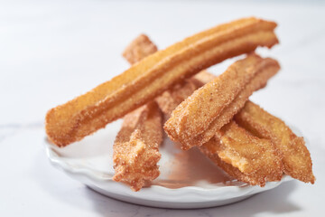Homemade Spanish churros with sugar and cinnamon.