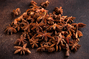 Anise stars herbs on rustic old table.