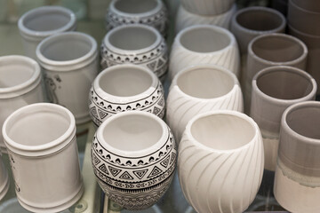 Ceramic flower pots in the store. Garden decor. Close-up.