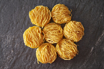 Dried pasta on marble background