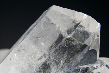 Quartz with mineral inclusions in the studio in front of a background photographed in Marco mode 