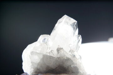 Quartz with mineral inclusions in the studio in front of a background photographed in Marco mode 