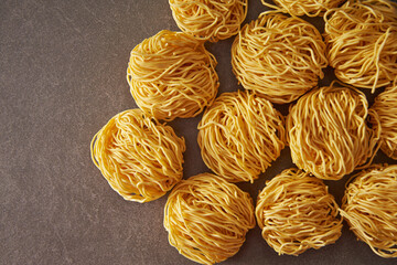 Dried Homemade Pasta Noodles on Gray Background