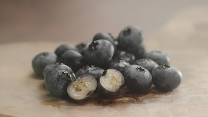 fresh blueberries on olive wood board