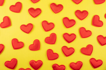 Valentine day yellow paper background with red hearts background. Valentines day or love concept