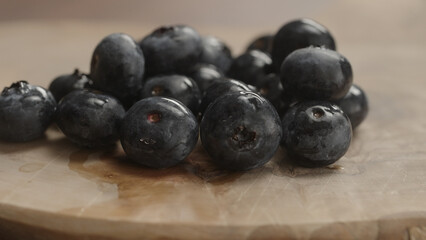 fresh blueberries on olive wood board