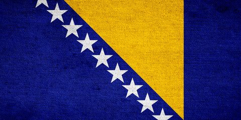 Bosnia and Herzegovina flag painted on old grunge paper 