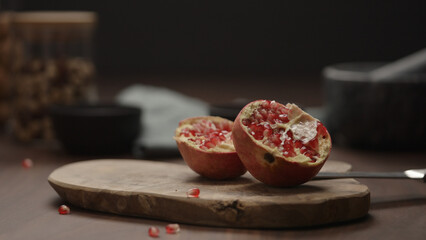 small pomegranate on wood board