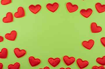 Valentine day green paper background with red hearts background. Valentines day or love concept, copy space