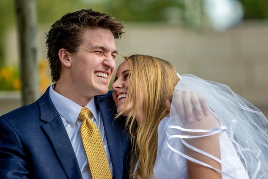 Bride and groom laughing