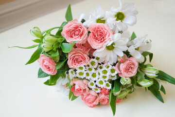 Wedding rings on the bride's wedding bouquet