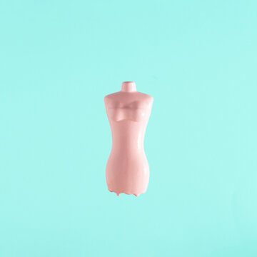 Body form against pastel blue background. Minimal creative concept, dieting, weight, measures.