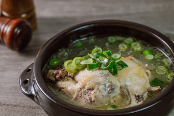 Samgyetang, Korean Ginseng Chicken Soup : Tender, whole, young chicken stuffed with ginseng, jujubes, sweet rice, and whole garlic cloves and simmered until tender. The combination of chicken and gins