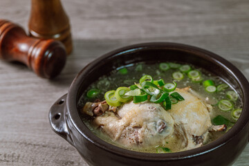 Samgyetang, Korean Ginseng Chicken Soup : Tender, whole, young chicken stuffed with ginseng, jujubes, sweet rice, and whole garlic cloves and simmered until tender. The combination of chicken and gins