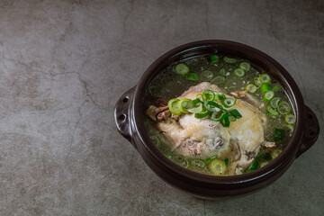 Samgyetang, Korean Ginseng Chicken Soup : Tender, whole, young chicken stuffed with ginseng, jujubes, sweet rice, and whole garlic cloves and simmered until tender. The combination of chicken and gins