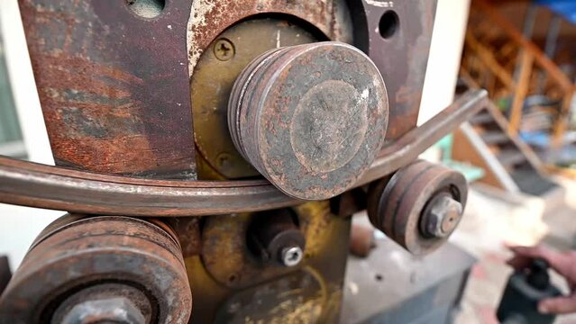Industrial machine for bending steel pipes and metal rods. Pipe bending machine. The industrial device for bending of metal pipes and plates.