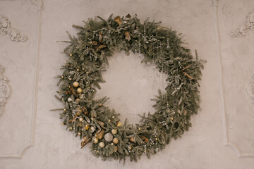 Fototapeta premium Christmas wreath made of spruce on a light background
