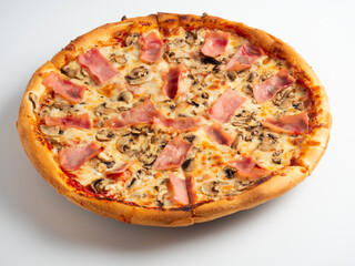 Close-up pizza with ham and mushrooms on a white background. A traditional Italian dish. A delicious and unhealthy dish. Top view, flat lay