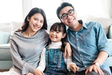 small asian family portrait at home