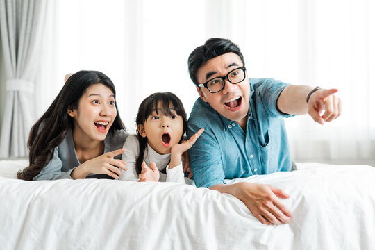 Small Asian Family Portrait At Home