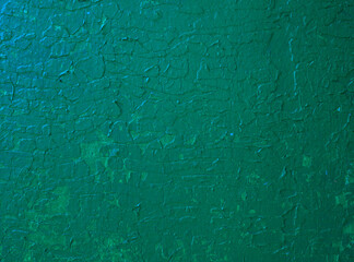 Abstract colored background of green paint on the wall.