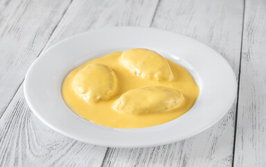 Quenelle with Hollandaise sauce