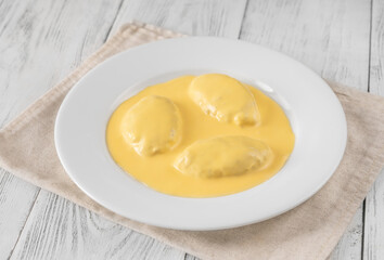 Quenelle with Hollandaise sauce