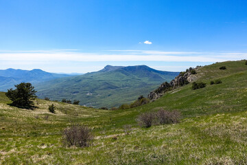View of the Chatyr-Dag plateau from the top of the Demerdzhi mountain range in Crimea. Russia.