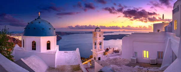 Foto op Canvas Fantastic Sunset night view of traditional Greek village Fira on Santorini island, Greece, Europe. luxury travel. famous travel landscape. Summer holidays. Travel concept background. © Tortuga