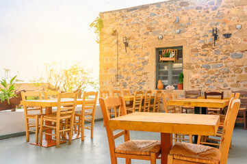 Sunny scene Traditional outdoor cafe in a Greek resort. summertime in mediterranean. famous travel destination