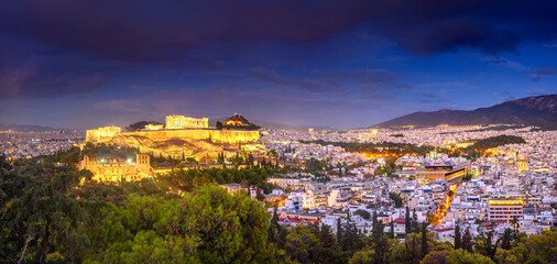 Panorama of night Athens with Acropolis hill crowned by the Parthenon, Athens, Greece, Europe. The Old Acropolis is the main attraction of Athens.