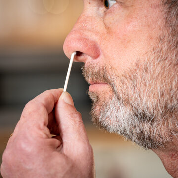 Man With Nose Swap Preparing For A Covid Test