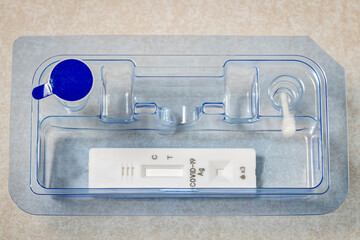 Closeup of an at home covid test with all components