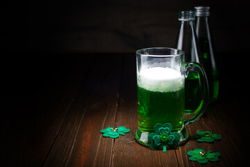 Green beer pint for Saint Patrick day on wooden table