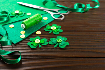 Sewing items for St Patrick decoration on wodden table