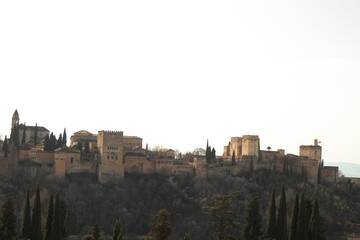 Obraz premium view of Alhambra Palace in Granada, Spain with Sierra Nevada mountains at the background during the sunny day
