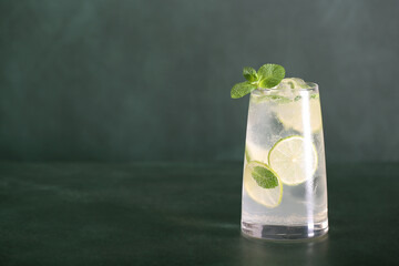 mojito drink with lime and mint ice is on the table, there is a place for recording