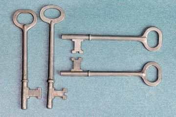 Four Skeleton Keys on a blue background