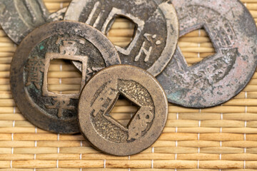 Fototapeta na wymiar Antique Brass and Silver Asian Coins