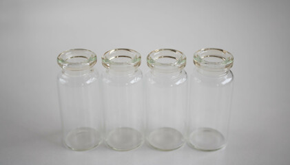 Empty glass bottles for storing medicines, liquids on a white background