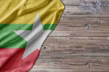 Wooden pattern old nature table board with Myanmar flag - 485400762