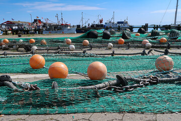 Fishing nets spread out to dry in the harbour, Fehmarn, Germany