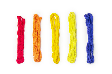 Multicolored threads of a mulino on a white background