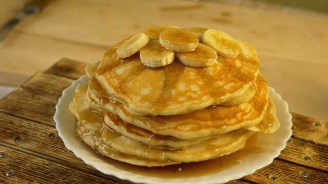 pancakes with banana and maple syrup