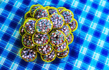 Checkered blue tablecloth cupcakes hearts homemade colorful food